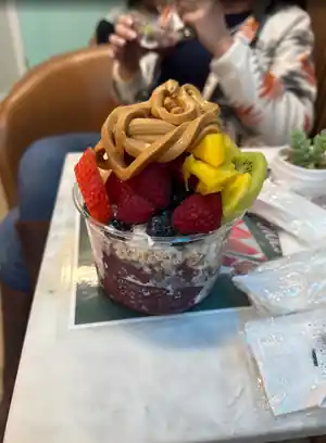 Customer photo — bowl topped with peanut butter and berries